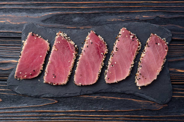 istock Sliced tuna steak with sesame photography . Top view 2184789805