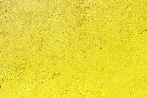 istock Texture of an old yellow plastered wall. 2184790471