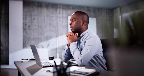 istock African American Man Praying 2184790812