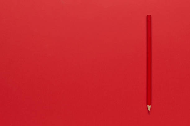 istock Minimalist Red Pencil on Red Background: Creative Simplicity Art 2184794138