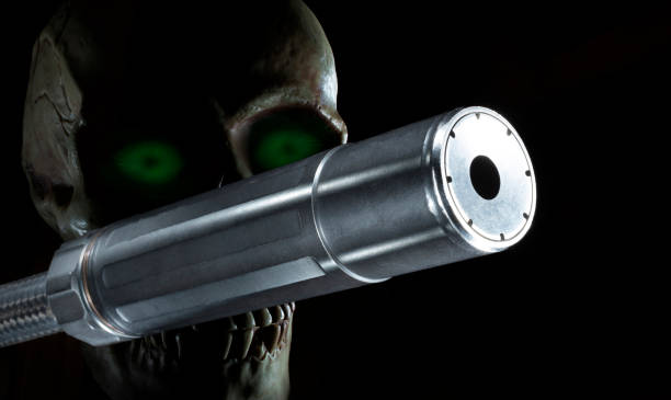 istock Skull with glowing green eyes behind a silencer 2184794481