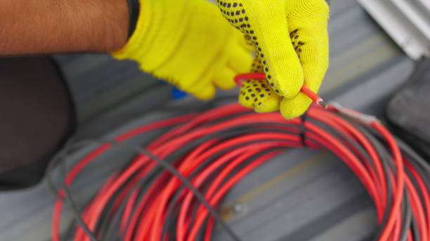 istock Electrician technician worker with wire stripper plier prepares the electric cable in electrical system. Electrician installing wires. A professional electrician removes electrical insulation 2184795623