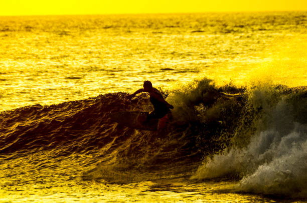 istock A surfer is riding a wave in the ocean 2184797670