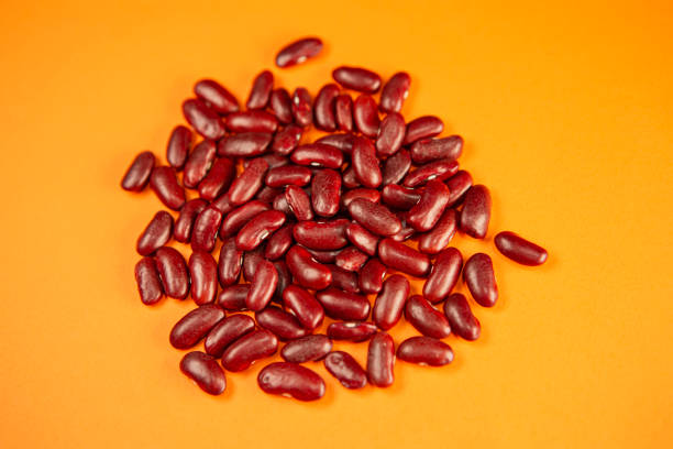istock red kidney beans on orange background 2184797975