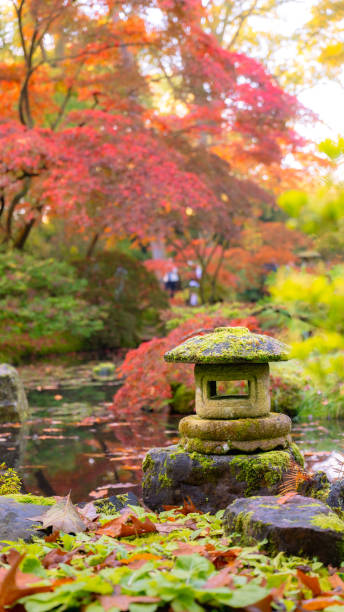istock old garden stone lantern in autumn park 2184800533