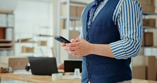 istock Businessman, hands or typing with phone in logistics for supply chain, online distribution or courier services at office. Closeup, man or employee on mobile smartphone for communication, app or order 2184800636