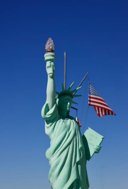 istock Statue of Liberty against a blue sky 2184802148