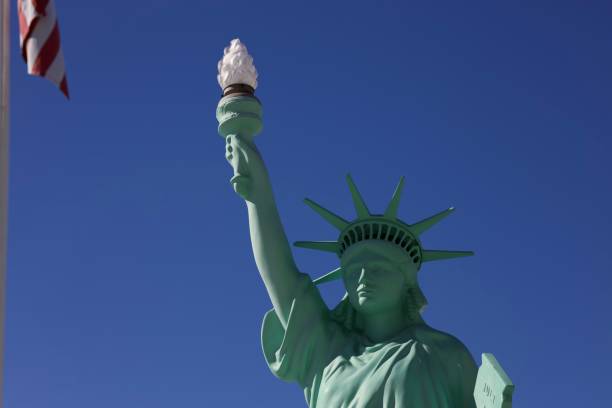 istock Statue of Liberty against a blue sky 2184802149