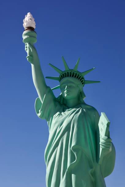 istock Statue of Liberty against a blue sky 2184802150