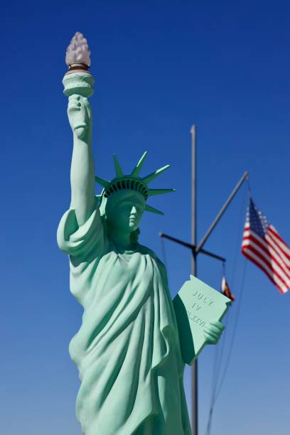 istock Statue of Liberty against a blue sky 2184802153