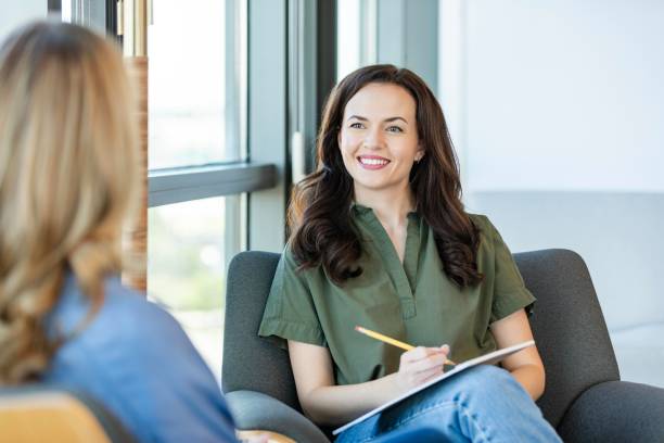 istock Counselor smiles at patient during counseling session 2184805797