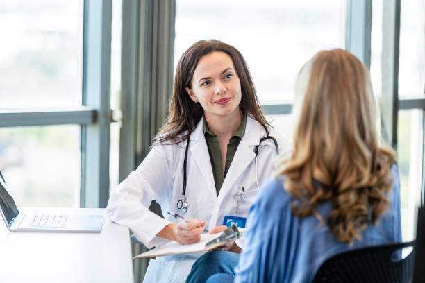 istock Attentive doctor listens to patient's symptoms 2184805828