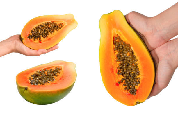 Papaya fruit isolated on a white background. Tropical fruit. Half papaya. Top view.