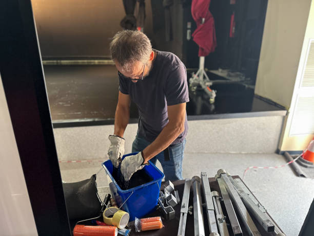 istock Man technical service worker preparing paint to paint the stage of a theater 2184810639