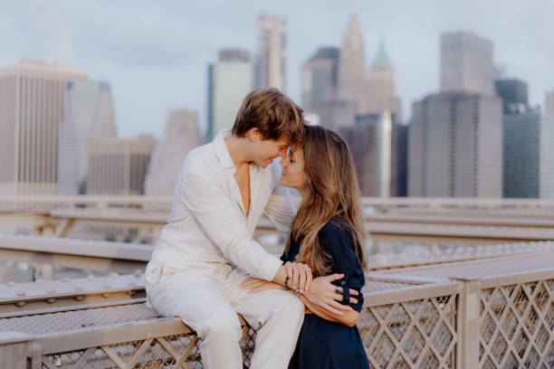 istock A Romantic Couple Deeply Embracing Each Other on the Beautiful Brooklyn Bridge at Dusk 2184814945