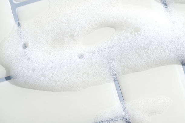istock Soap Bubbles on Clean White Bathroom Tiles 2184816379