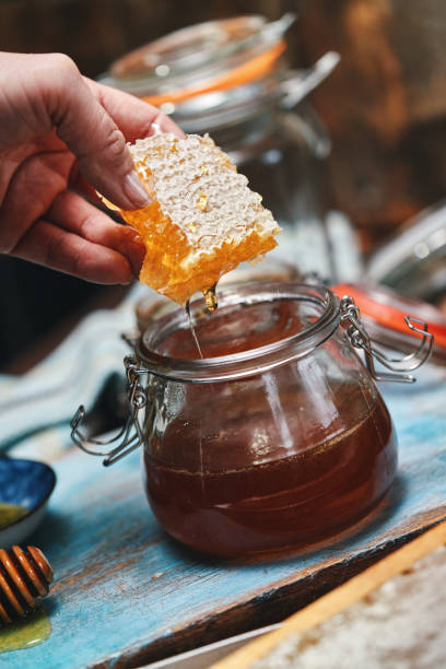 istock Healthy Honey Slow Dripping from  Honeycombs 2184816464