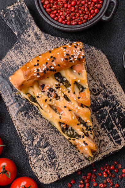 istock Pieces of quiche with salmon, spinach or broccoli, salt and spices 2184816575