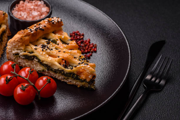 istock Pieces of quiche with salmon, spinach or broccoli, salt and spices 2184816751