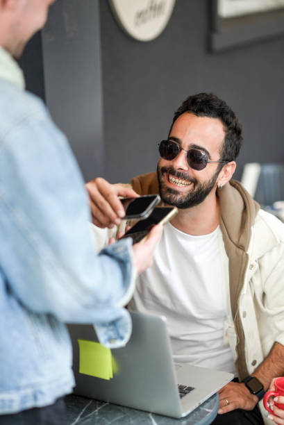 istock Small Business , Young Man Pay With Contactless Payment Method 2184817803
