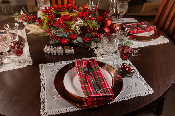 Elegant Christmas Table Setting with Festive Decorations and Plaid Napkins