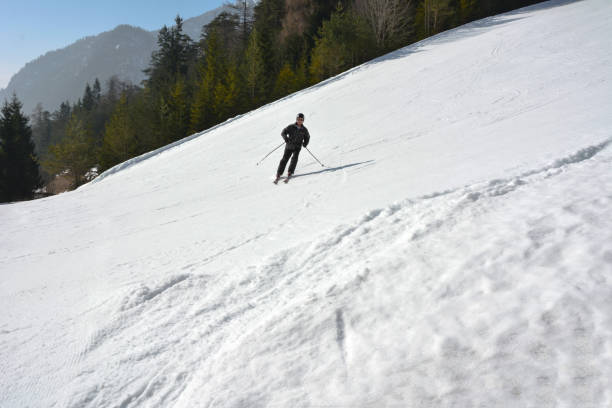 istock A skier is going down a steep ski track. Active winter recreation at a ski resort. 2184823472