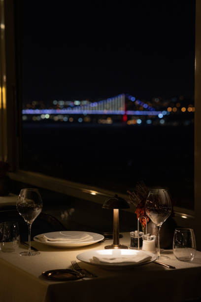 istock Night view of Istanbul Bosphorus Bridge seen from a luxurious restaurant with moonlit sky, Turkey 2184823598