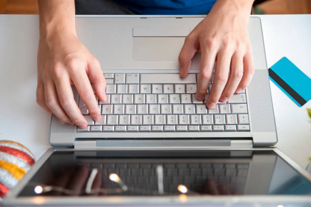 Man passes online christmas order at home