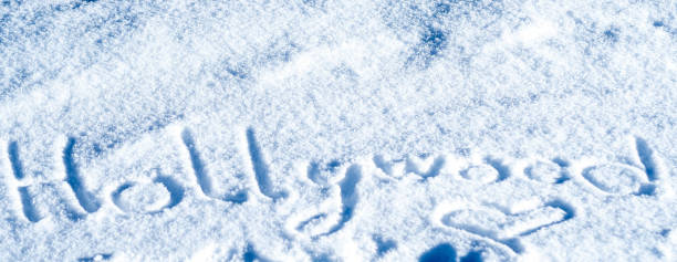 close up word Hollywood written in the snow
