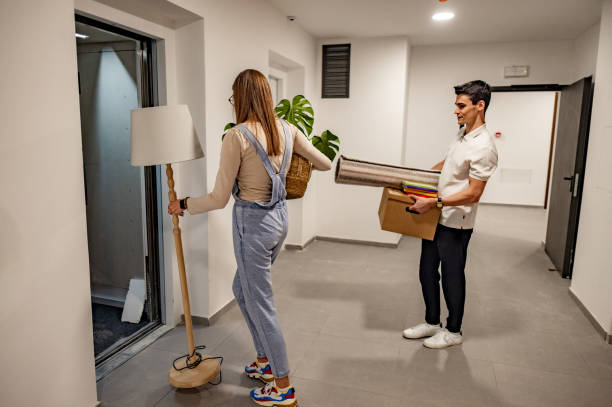 istock Young couple waiting in front of elevator during relocation 2184825757