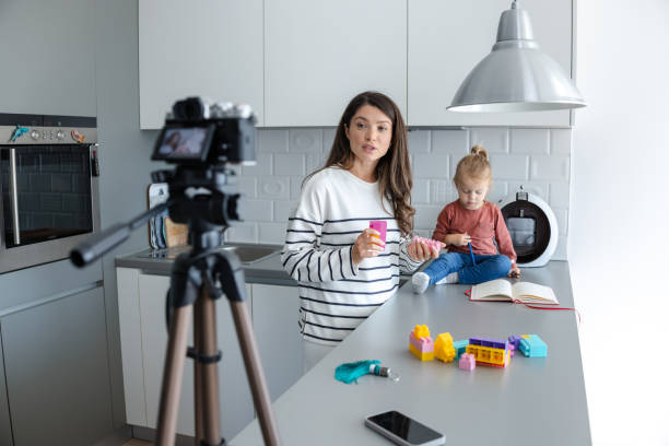 Mother and daughter creating online content in a cozy kitchen