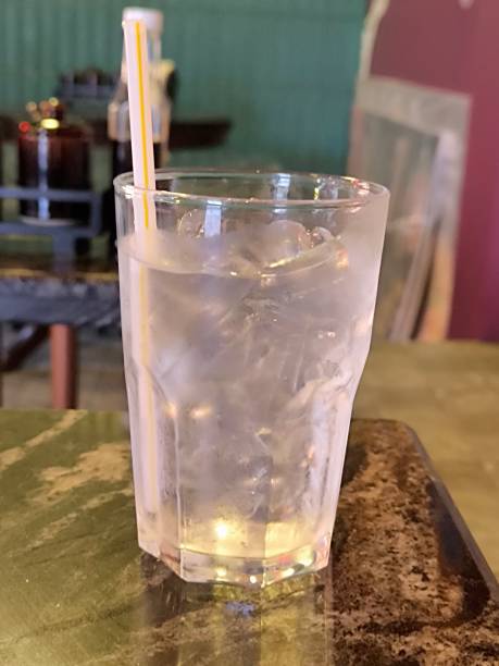 istock Iced drinking water. Cold water with ice cube in glass. Refreshment and hydrate concept. 2184826999