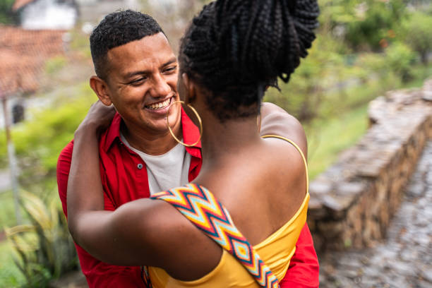 istock Couple embracing in a public park 2184827783