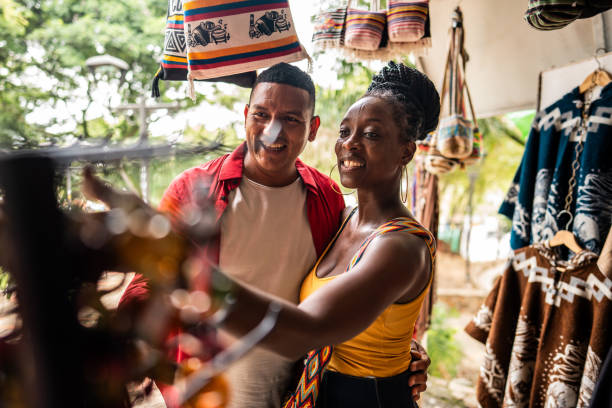 istock Tourist couple choosing clothes in a store 2184827892