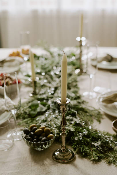 istock Long White Candles in Candle Holders 2184828577