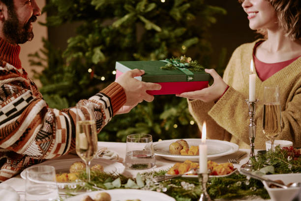 istock Couple Exchanging Gifts 2184829637