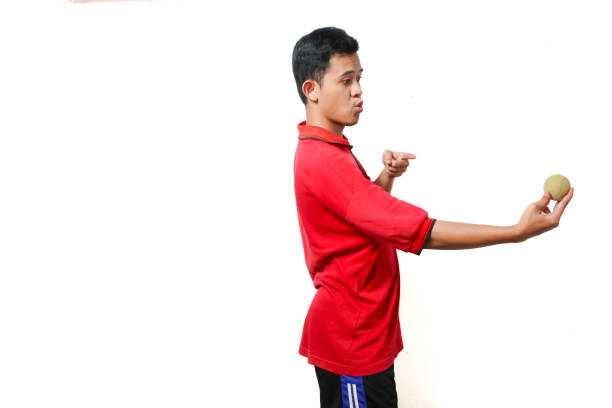 istock Asian man holding baseball with surprised expression isolated on white background 2184830134
