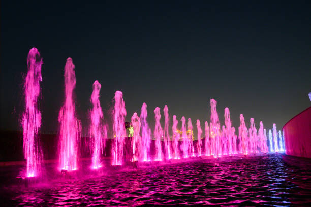 istock Lighted water show in the pool at night 2184831125