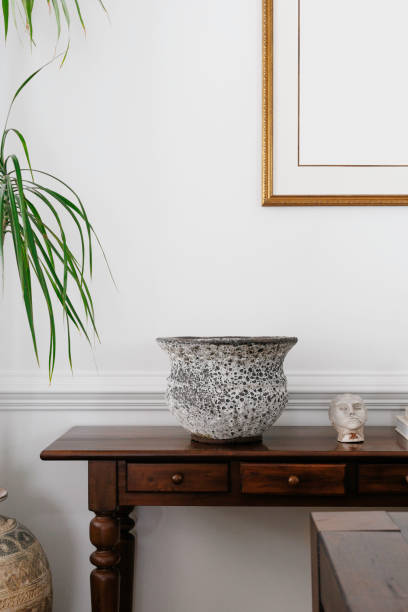 istock Vase And Figurine On Wooden Side Table With Decor 2184831538