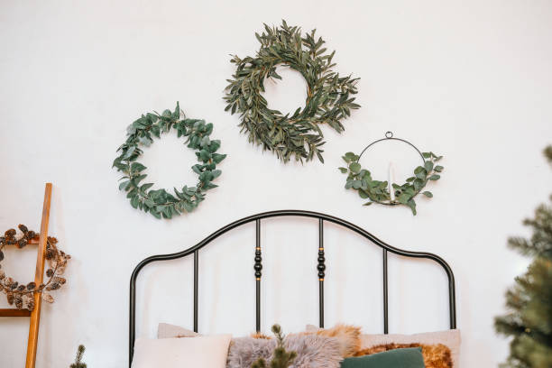 istock Decorative wall wreaths above a cozy bed in a serene indoor space 2184840580