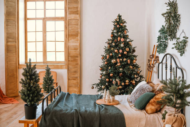 istock Cozy bedroom adorned with a Christmas tree and festive decorations during winter 2184840594