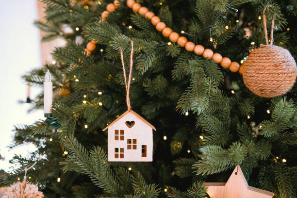 istock Decorated Christmas tree adorned with wooden ornaments and warm lights 2184840595