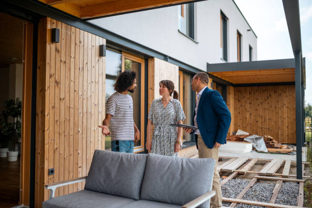 istock Diverse Couple in Discussion with Hispanic Real Estate Agent 2184841742