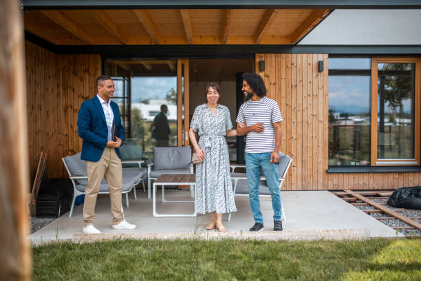 istock Diverse Couple Consults with Hispanic Real Estate Agent 2184841744