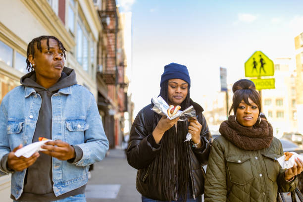 istock Friends Enjoying Snacks on a Sunny Day Walk 2184841908