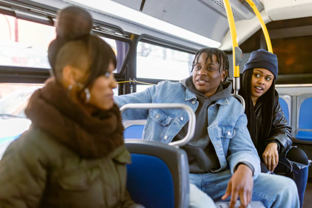 istock Friends Sharing a Lively Conversation on a Morning Bus Ride 2184841927