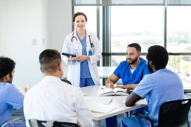 istock Female doctor helps medical students 2184842015
