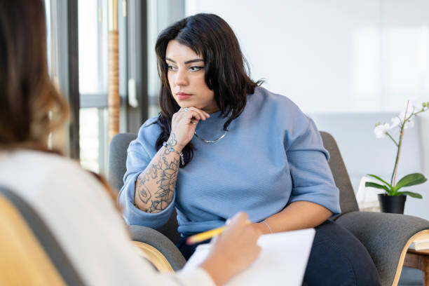 istock Depressed woman attends counseling session 2184842070