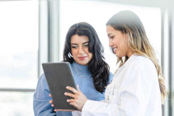 istock Doctor reviews test results with patient 2184842073