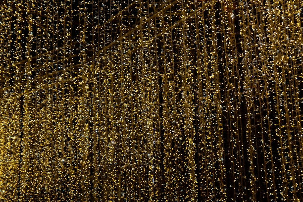 istock Bright Christmas lights on a dark sky background 2184842419